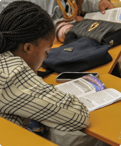Picture of a man praying with his hands clasped togther.